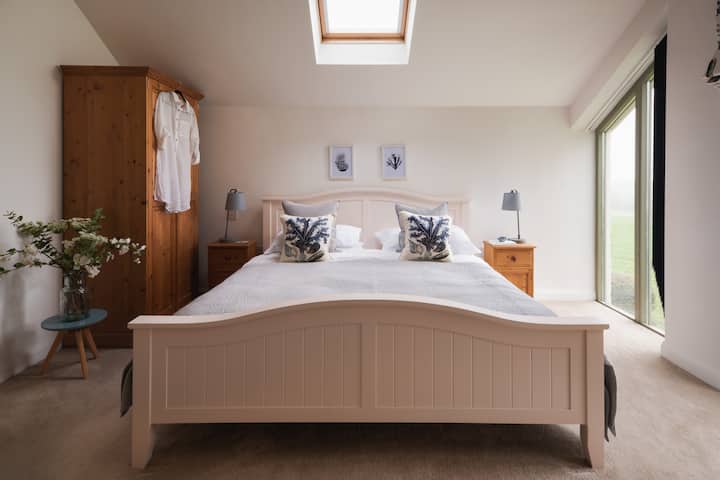 Sink into the super-comfy Super-King bed and reach for the remote control to shut the blinds 