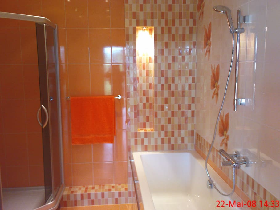Bathroom with bath and shower