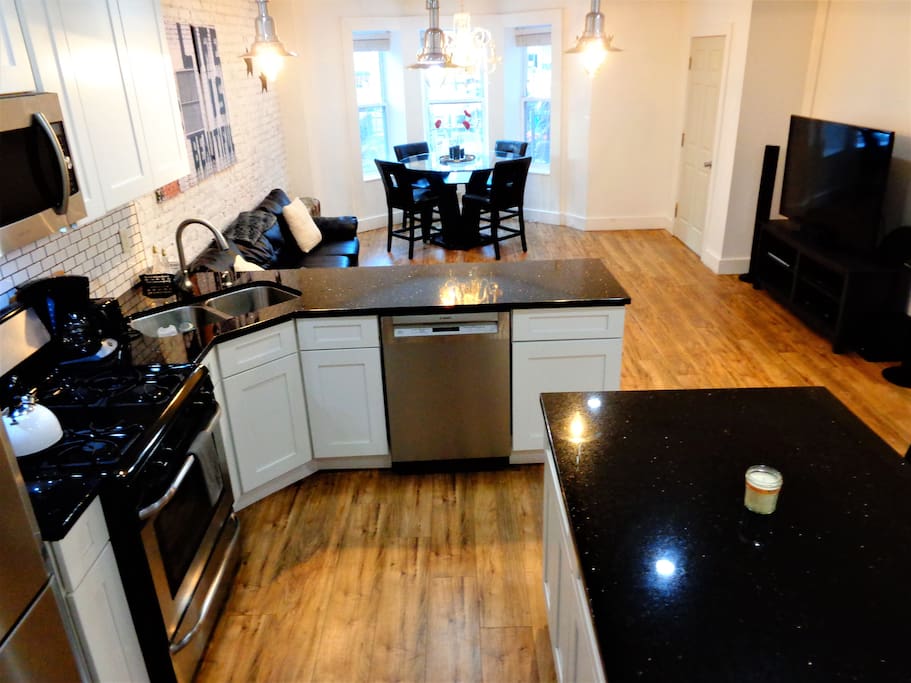 Upper Duplex has open kitchen, dining and living area layout.