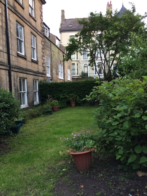 Small communal garden to the front of the building.