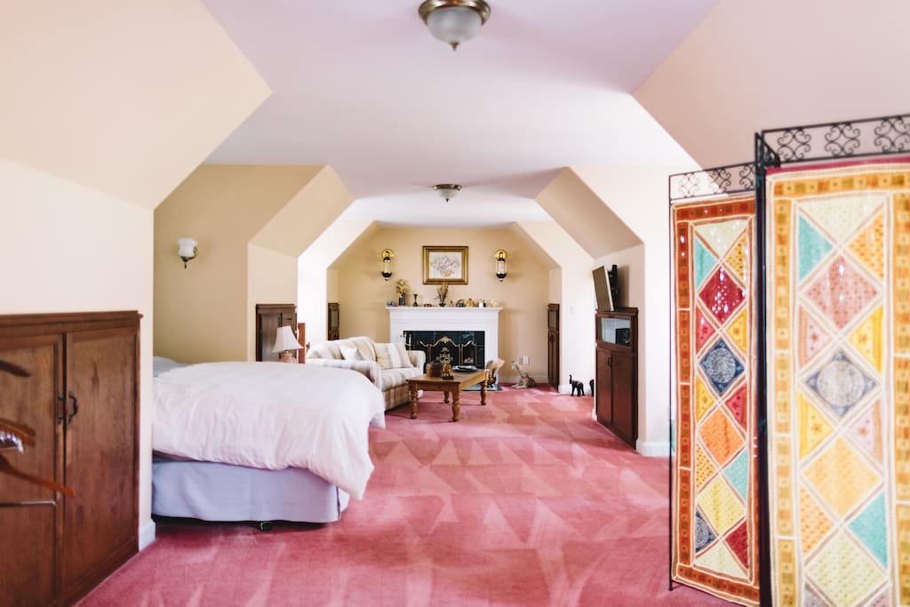 Two flights of stairs lead to your spacious "upstairs loft".
Aside from the reg. queen size bed, this room could accommodate up to two additional queen-size Aero-beds for additional guests