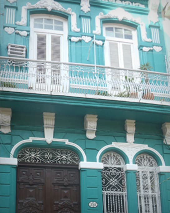 The building out and our balcony on Empedrado Street.