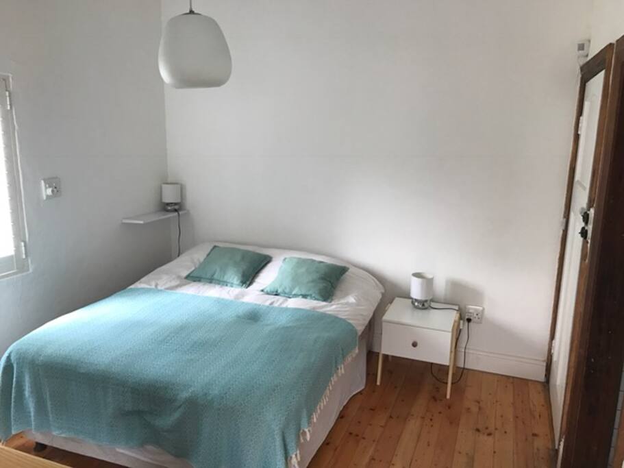The bedroom with queen-size bed