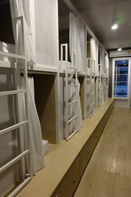 Mixed Dormitory room with 10 beds that suitable for big group/family and 5 beds of the sky view roof.