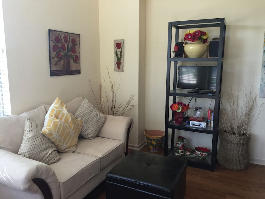 Open floor plan living area with television, stereo