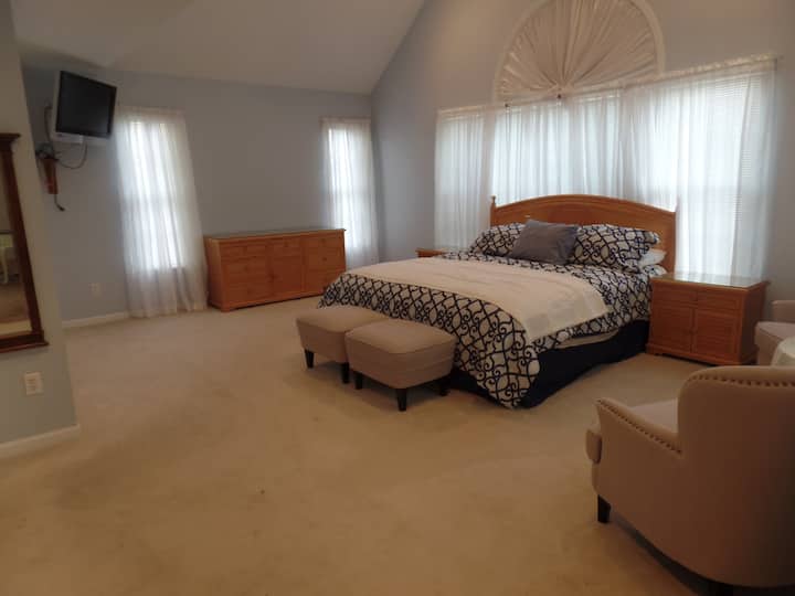 First floor master en-suite with king bed and smart TV. Large bathroom with separate water closet. 