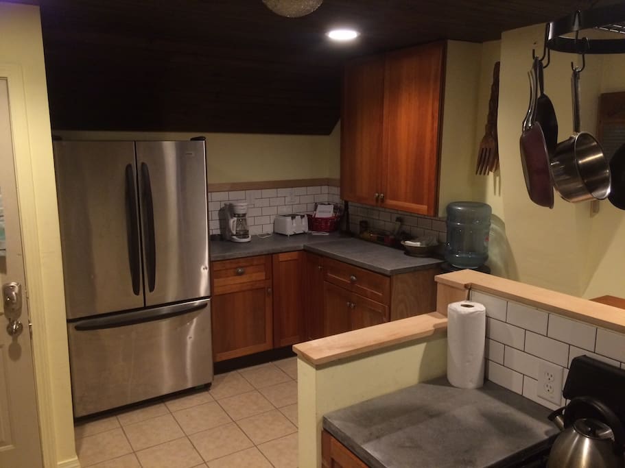 Updated kitchen with Full refrigerator and gas range