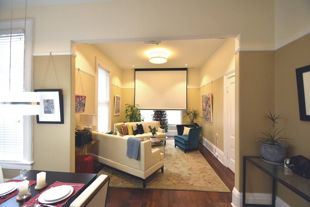New furniture gives a fresh update to the room and allows for better flow into the living room and with the entry door. You can still seat 7+ people comfortably. There are 2 red movable stools and additional chairs that can be brought in temporarily.