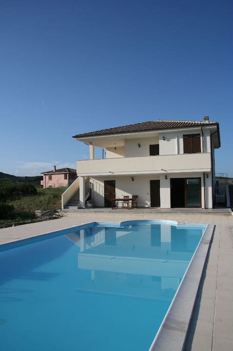 The swimming pool and house