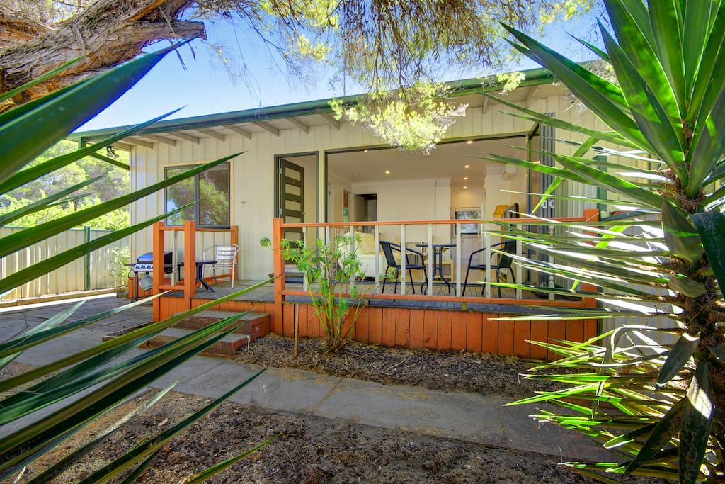 This view of the veranda with the windows fully open to create and inside/outside living area.