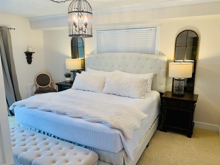 Master bedroom on ground floor with king bed, beach access off walk out deck, including hot-tub on deck, full bath with jetted wall shower, walk in closet and satellite flatscreen TV.