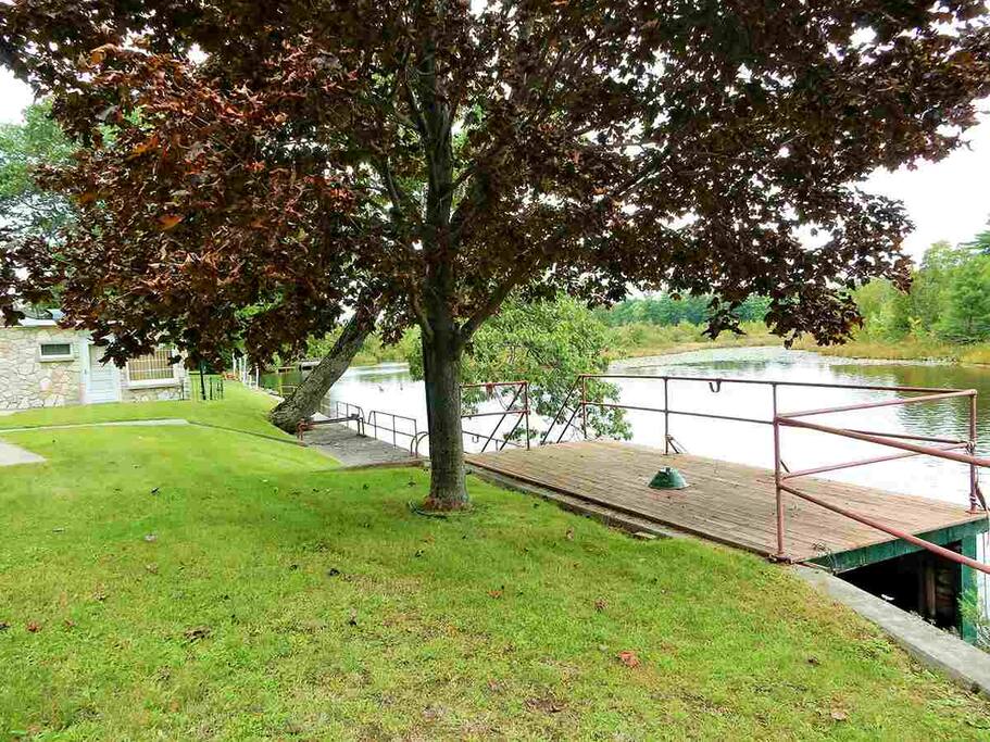 Deck right on the river over the boat house (no boat but you can bring your own small boat, kayak, or canoe). Picture below shows the patio table and chairs on this deck.