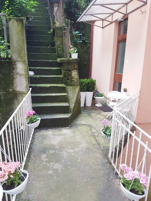 Entrance to the flat across atractive bridge. No one uses this entrance. You can sit in front and relax