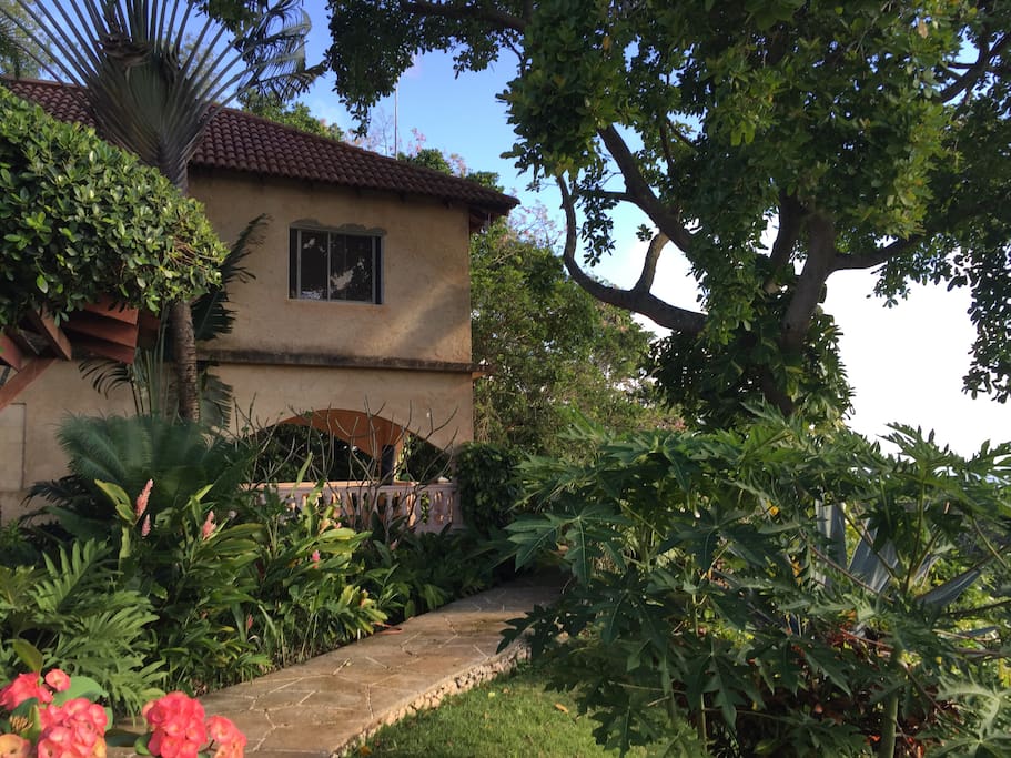 Lush, tropical gardens cover the grounds.