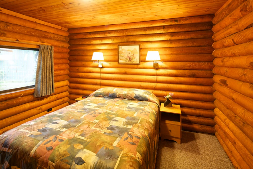 Bedroom features a queen size bed.