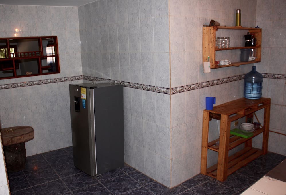 Our Kitchen with Fridge.
We offer basic equipment, filtered water, coffee, tea and basic spices