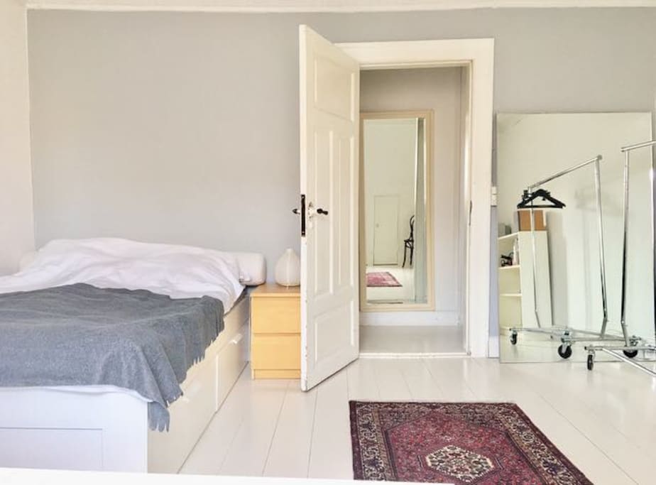 Comfortable double bed 140 x 200 cm and a large mirror.