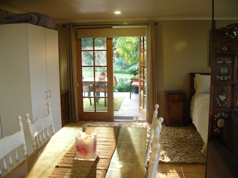 French doors leading onto private deck overlooking gardens