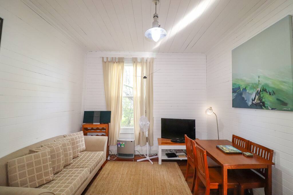 Lounge room and dining with tv and heater
