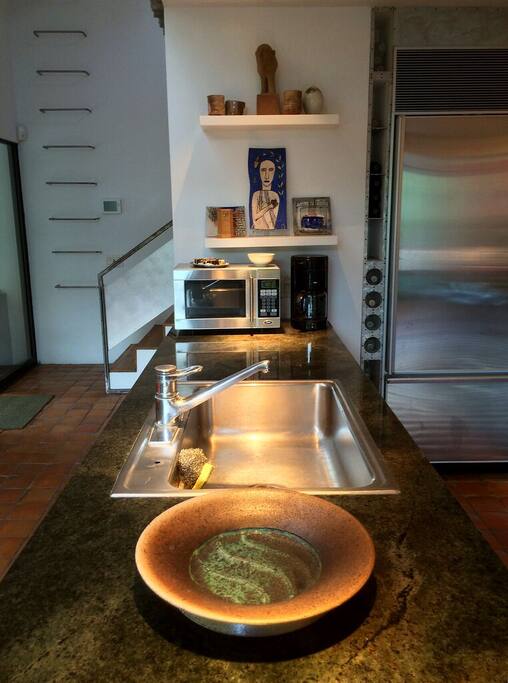 Kitchen, with granite countertops, SubZero fridgerator, dishwasher, microwave, convection oven, gas stove top