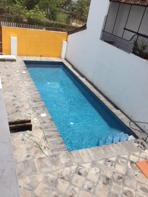 The pool area, is has a terrace with equipales, that comfortable mexican furniture, made of leather