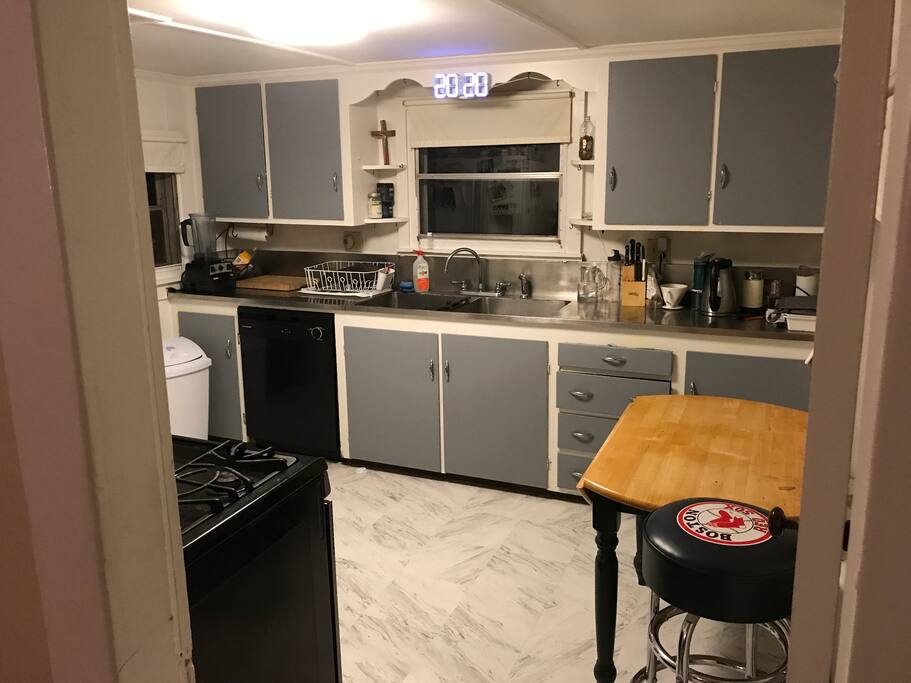 Kitchen has gas stove, brand new dishwasher, garbage disposal and a cool clock.