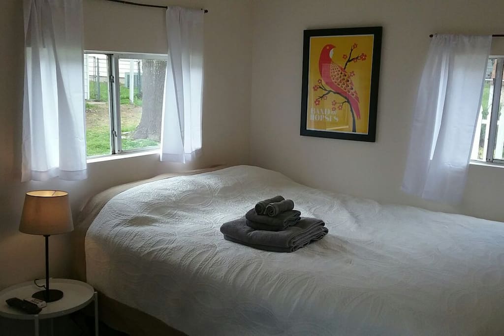 Comfortable queen bed with fresh linens and clean towels.