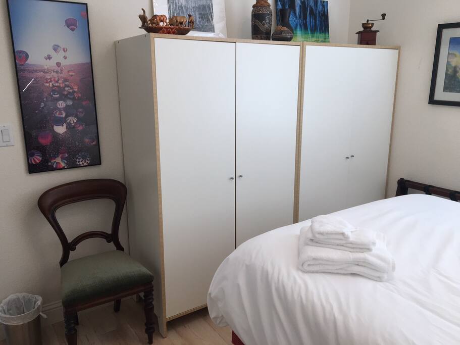 This closet on left with hanging rod and shelves also for guests