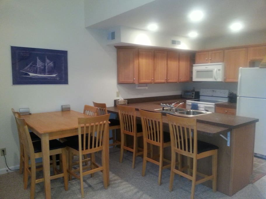 Comfortable open concept seating for eight with both formal & casual dinnerware
