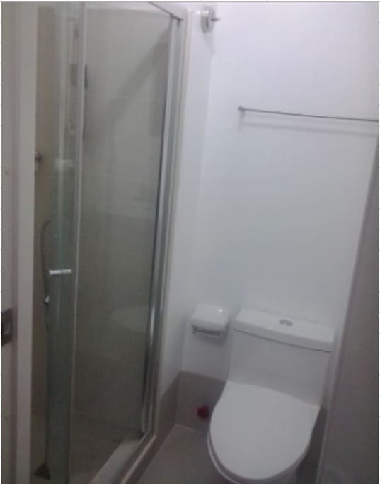 With shower heater and shower enclosure.