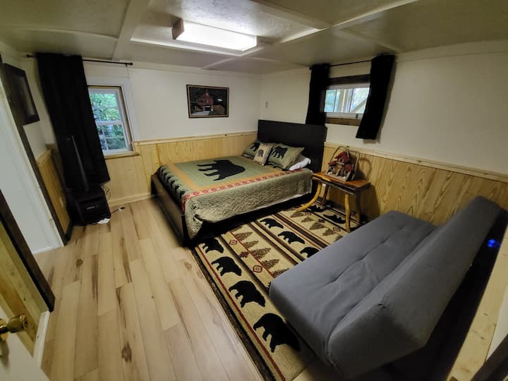 Additional cozy bedroom in the basement along with a half bath (not pictured)