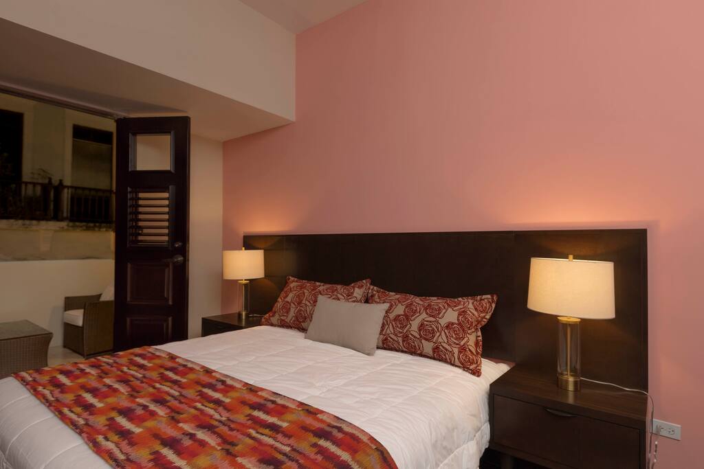 Hotel quality king bed with direct access to the terrace.