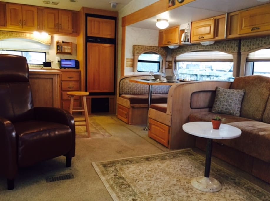 Spacious living room/dining area (dinette transforms into twin bed).