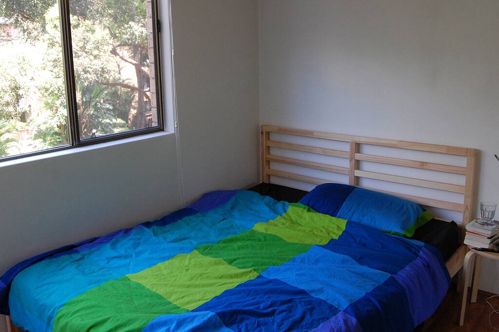 Queen bed, side table, lamp and built in wardrobe with mirrors make this room ideal to live in. The room gets loads of morning sunlight & gorgeous views of the garden and pool area.