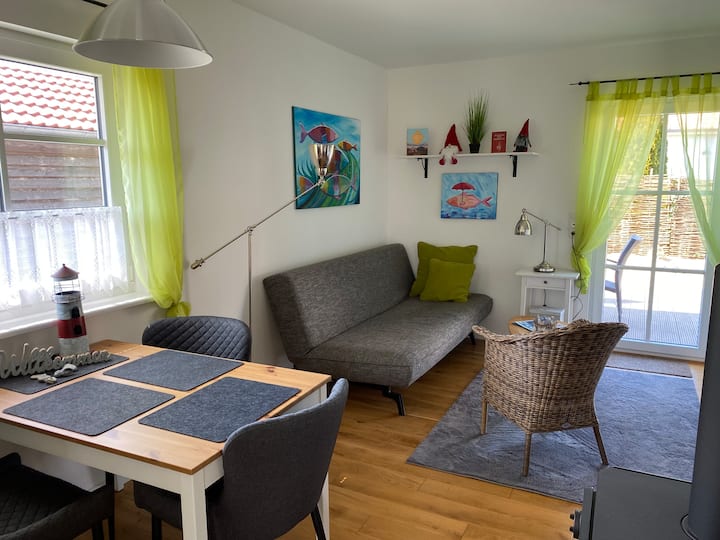Dining area and a living room/sofa with an entrance to the terrace