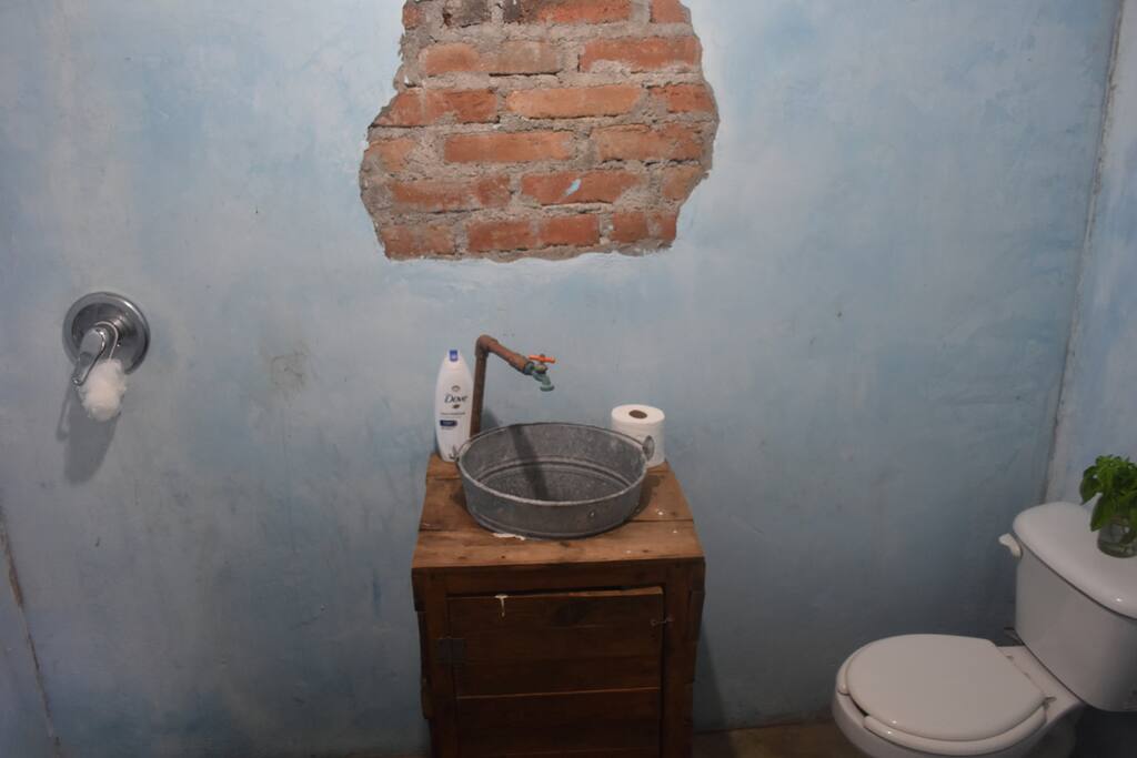 private bathroom with hot water shower