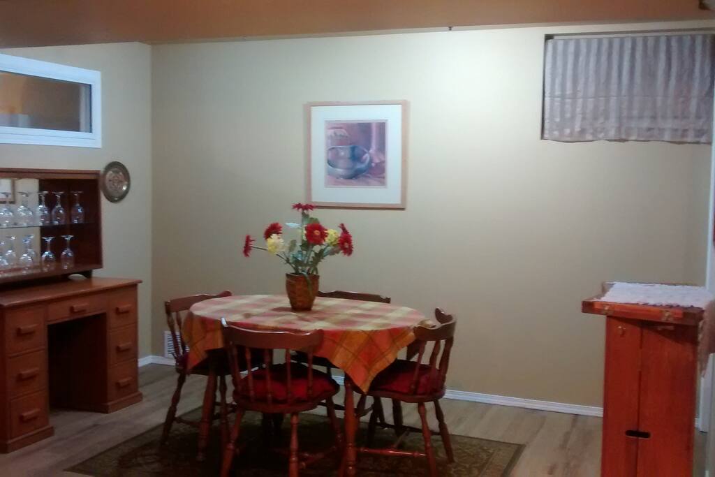 Dining room with culerry, glases, and dishes.