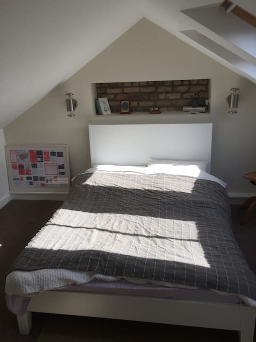 Attic Bedroom with en suite toilet and shower. Double bed with memory foam mattress topper. Bright, quiet and warm. Veluxes have blackout blinds.