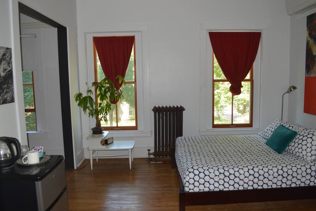 To the right is a small sitting area.