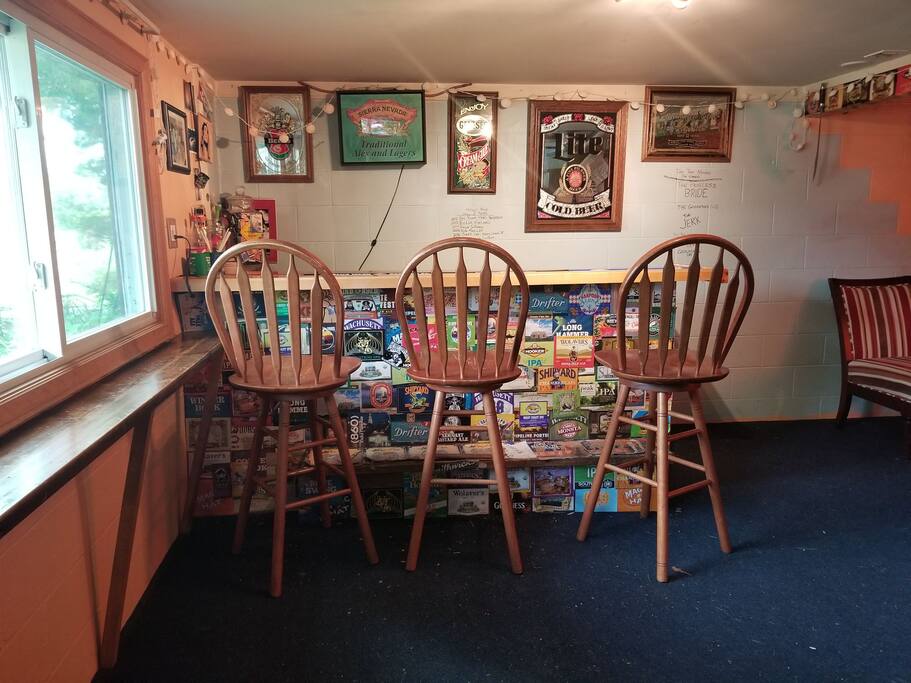 Basement bar is a good place to be noisy after the kids have gone to bed. Room is 12x24, other half is comfy chairs.