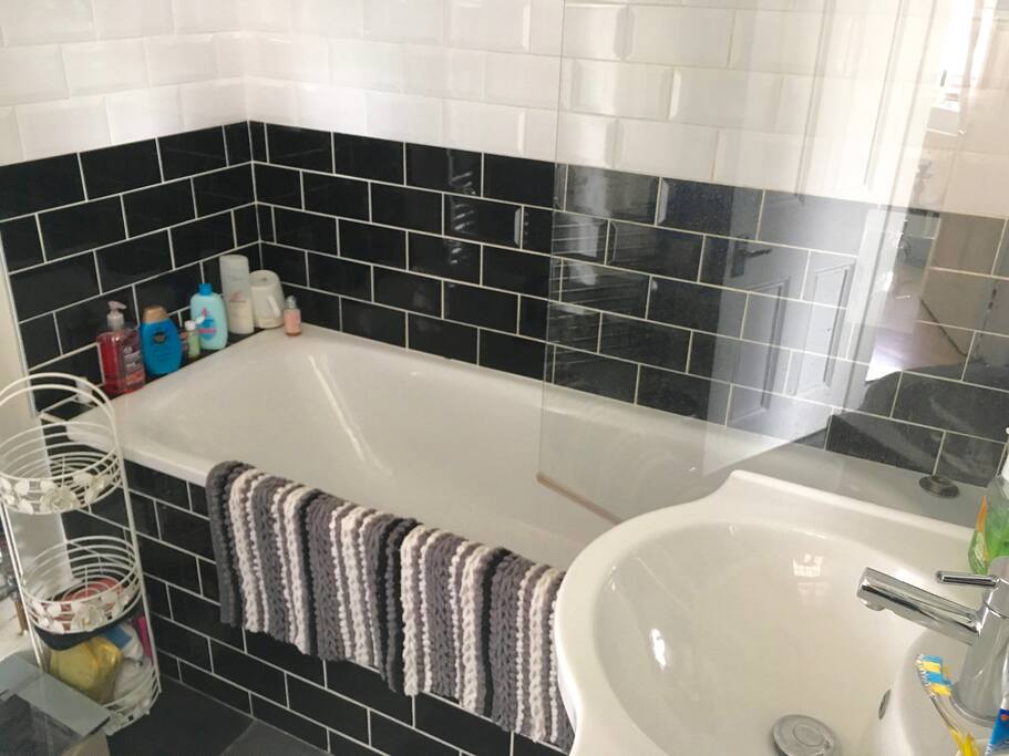 Shower room with comfortable bathtub.
