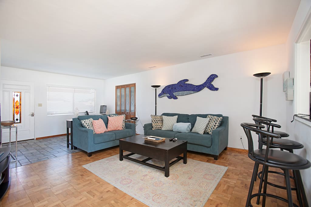 A queen-size pullout couch and love seat offer comfortable seating in the main living area.