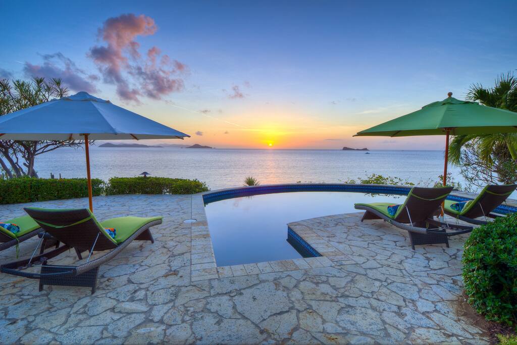 Watch the sunset between islands on the horizon