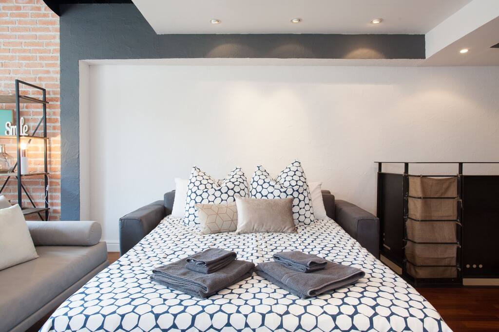 Pull out couch in the lounge which has an extra memory foam mattress topper for added comfort