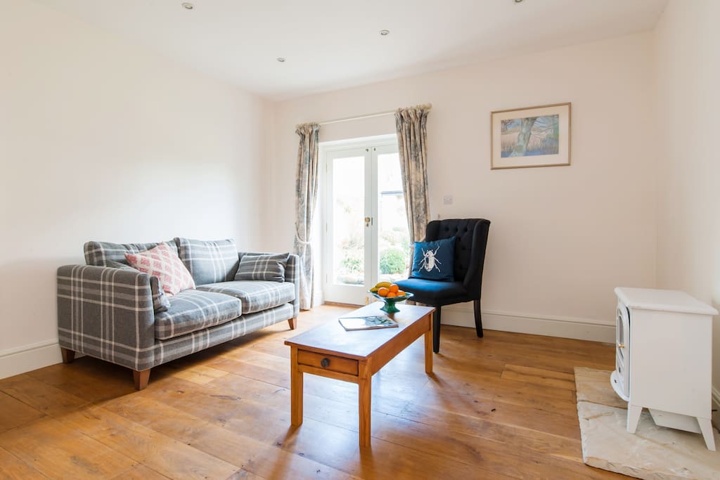 Our spacious sitting room provides plenty of space to relax and enjoy your stay. There is an electric fire as well in case you need to get super cosy.