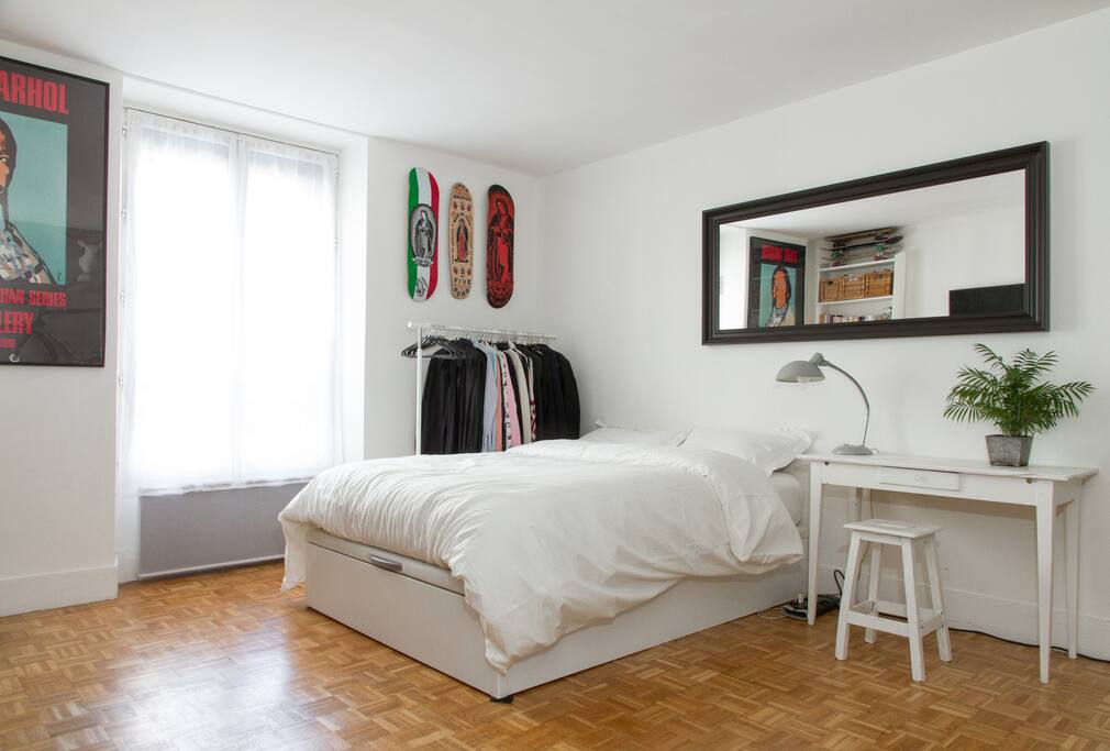 The living room with a very big and comfortable bed with fresh organic sheets