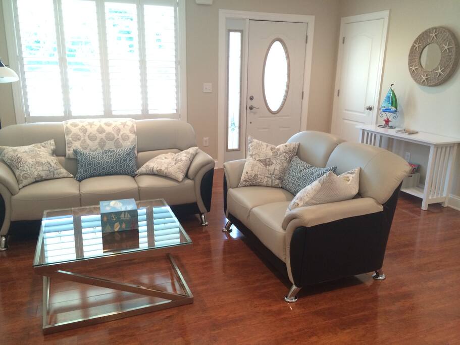 74 - Clean and modern furniture in the family room full of sunlight!