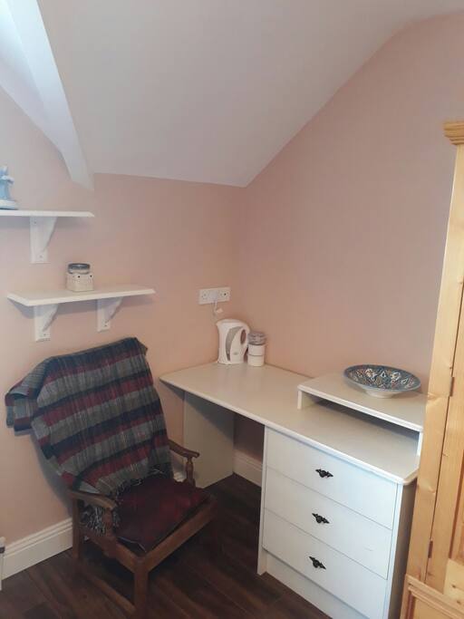 A Desk & Chair area with Tea/Coffee Facilities in the room.
