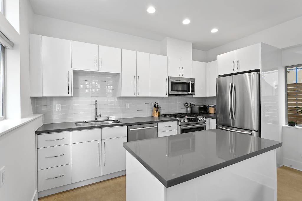 Kitchen complete with gas appliances, microwave, and toaster oven. You will have some fridge space & feel free to cook!
