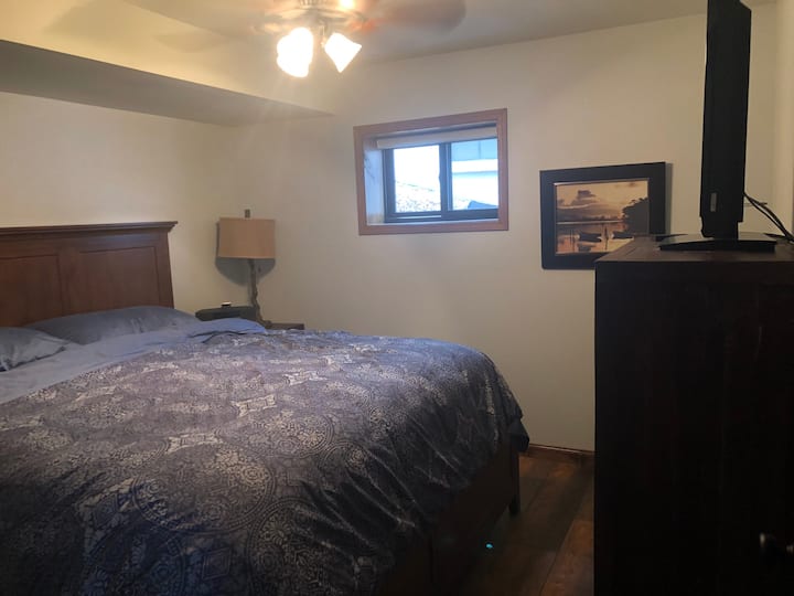 Master w/ king and bathroom shared with downstairs. It also has a TV.
